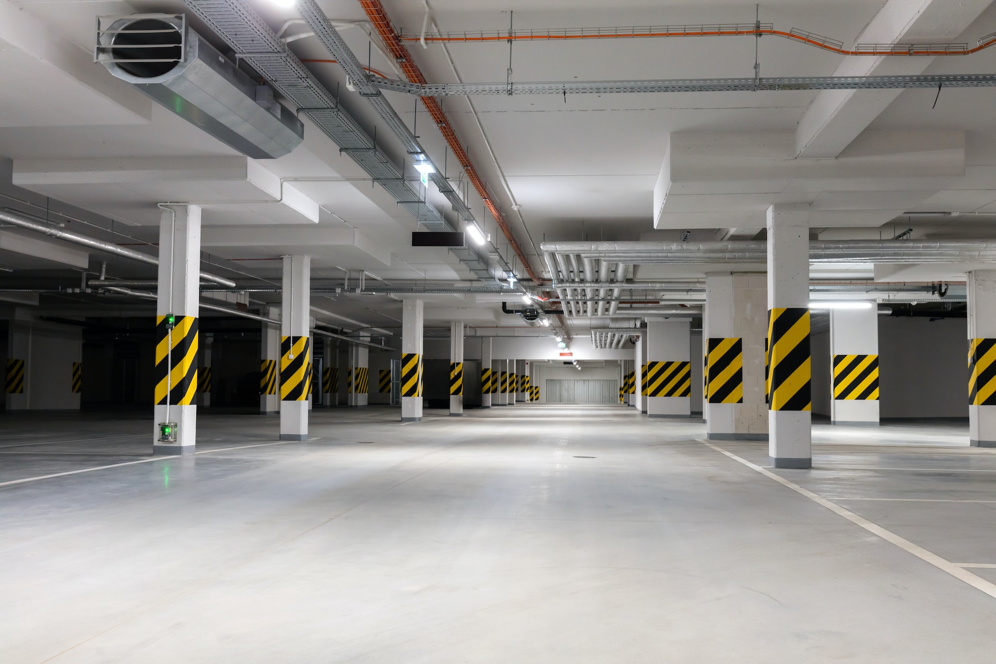 Underground empty parking garage. Modern urban space