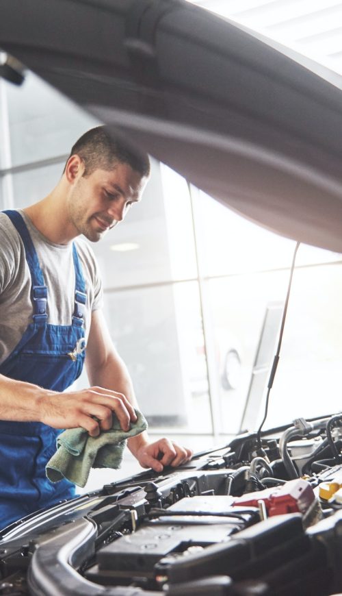 auto-mechanic-working-in-garage-repair-service